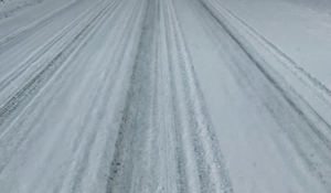 Eastbound Truck Overturns on Snow-Covered K-140, Driver Suffers Minor Injuries
